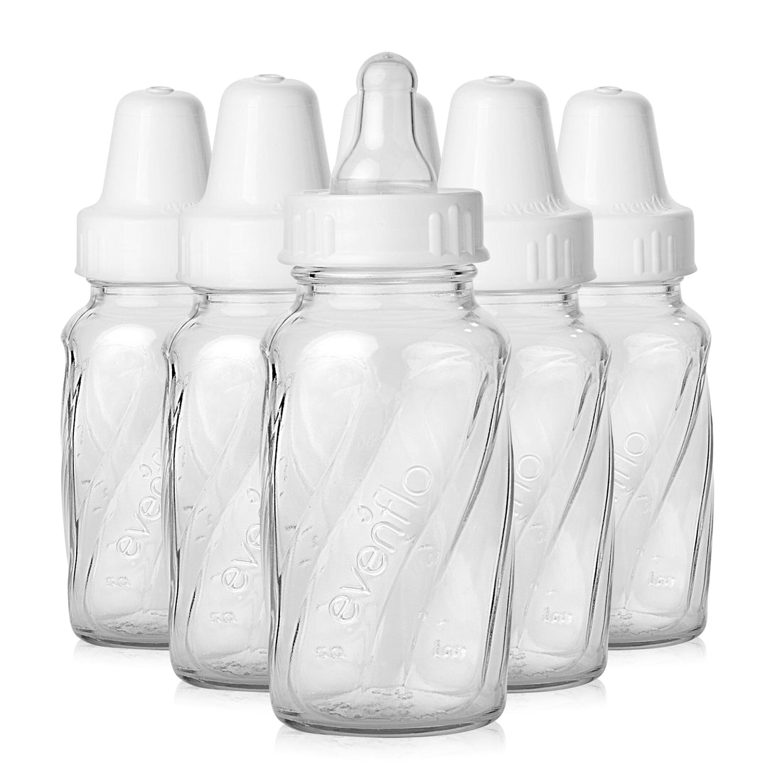 Six Evenflo Classic 4 oz clear glass baby bottles with white nipples and caps