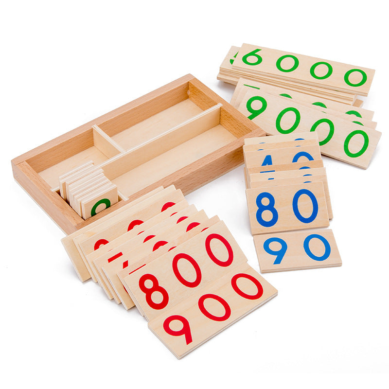 Montessori wooden number cards in a compartment tray with red hundreds, blue tens and green thousands