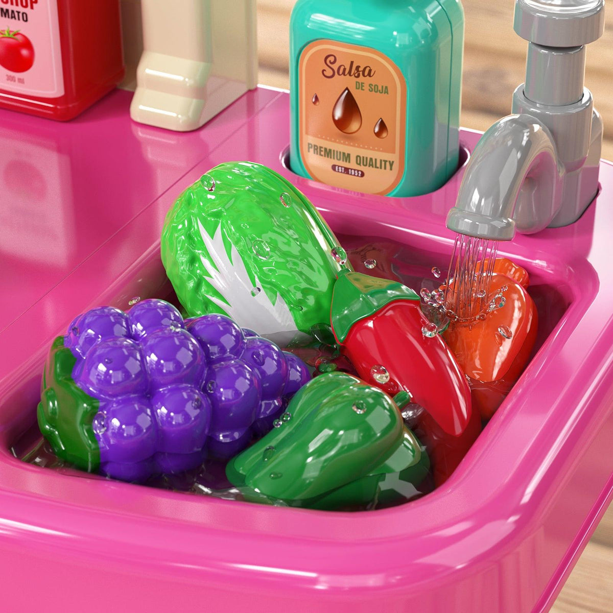 Pretend play kitchen sink with toy vegetables and faucet