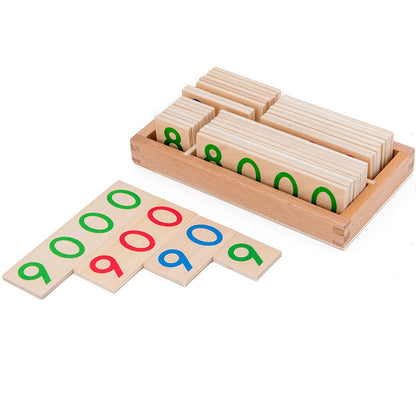 Wooden number cards stored upright in the tray with green, red and blue cards laid in front
